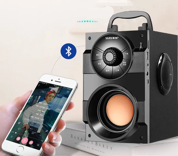 Black portable mini home audio system with subwoofer, satellite speakers, and a 3.5mm audio cable