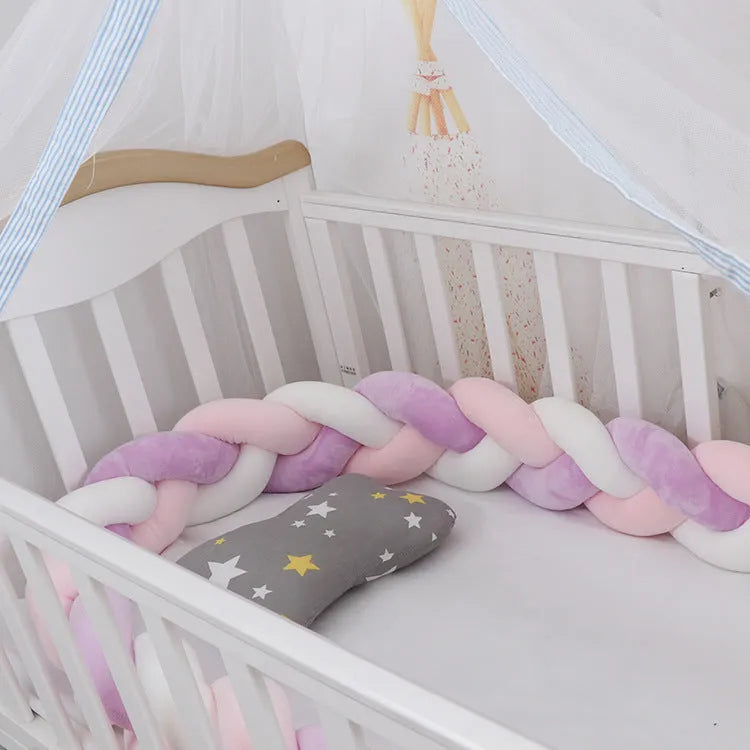 Braided knot design baby crib bumper in spandex velvet, shown in a light grey colour.