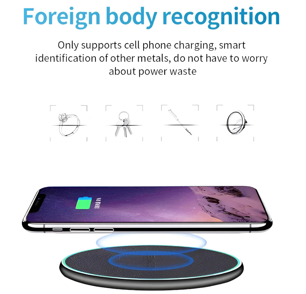 Black Qi wireless charging pad for iPhone 11 on a wooden desk