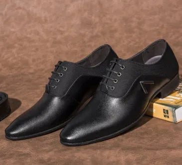 Men's black Oxford shoes with a low-cut PU leather upper and rubber sole on a white background