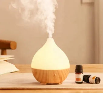 Wood grain finish vase-shaped USB aroma diffuser with 100ml water tank.