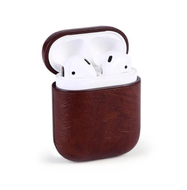 Genuine leather protective case sleeve for Apple Airpods charging case in black, brown, light brown, and red.