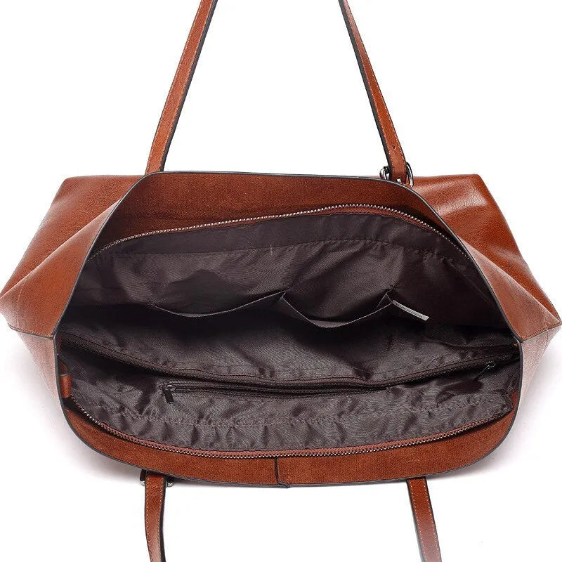 Waxed cowhide leather handbag showing horizontal cross-section opening and internal compartments