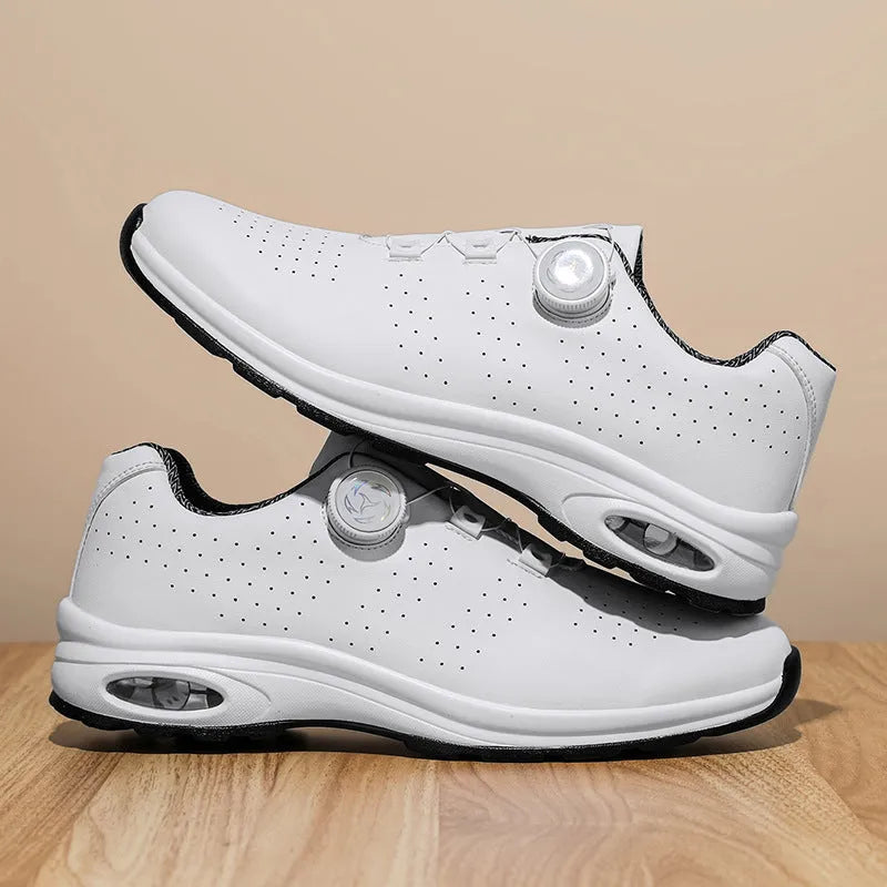 Low top mesh tennis shoes with cross straps and composite sole in black and white