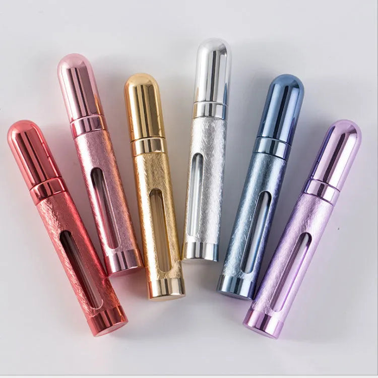 12ml aluminium portable perfume bottle in bullet shape with glass liner, shown in various colours.