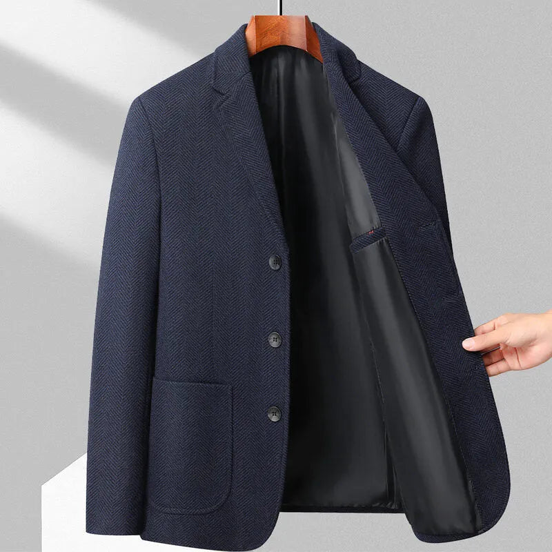 Man wearing a classic solid-colour, loose-fit wool blend coat suitable for spring and autumn.