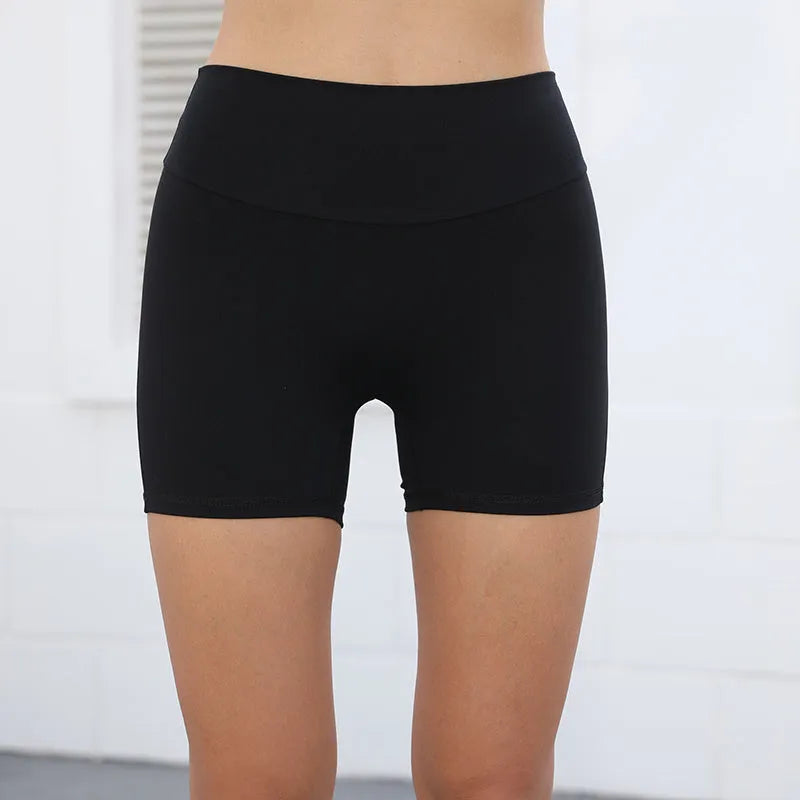 Women's high waist sport shorts in avocado green, side view showing pocket detail.