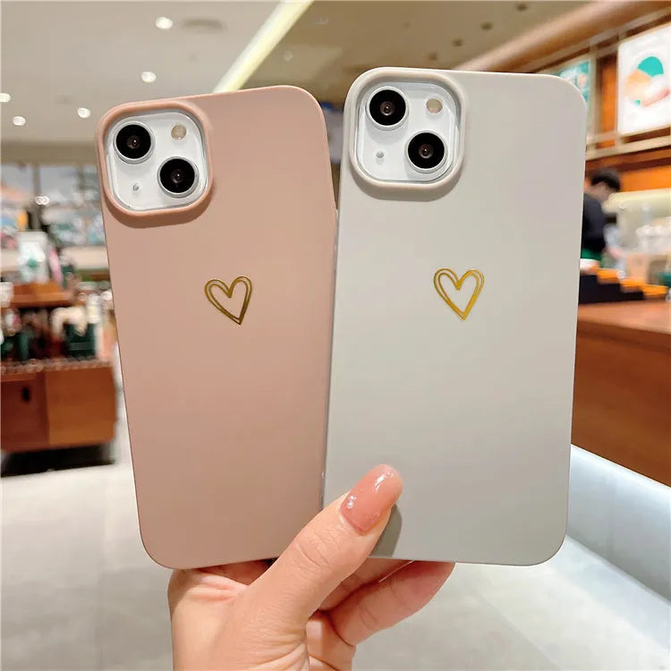 Brown silicone iPhone case with a hot stamped white love heart design on the back.