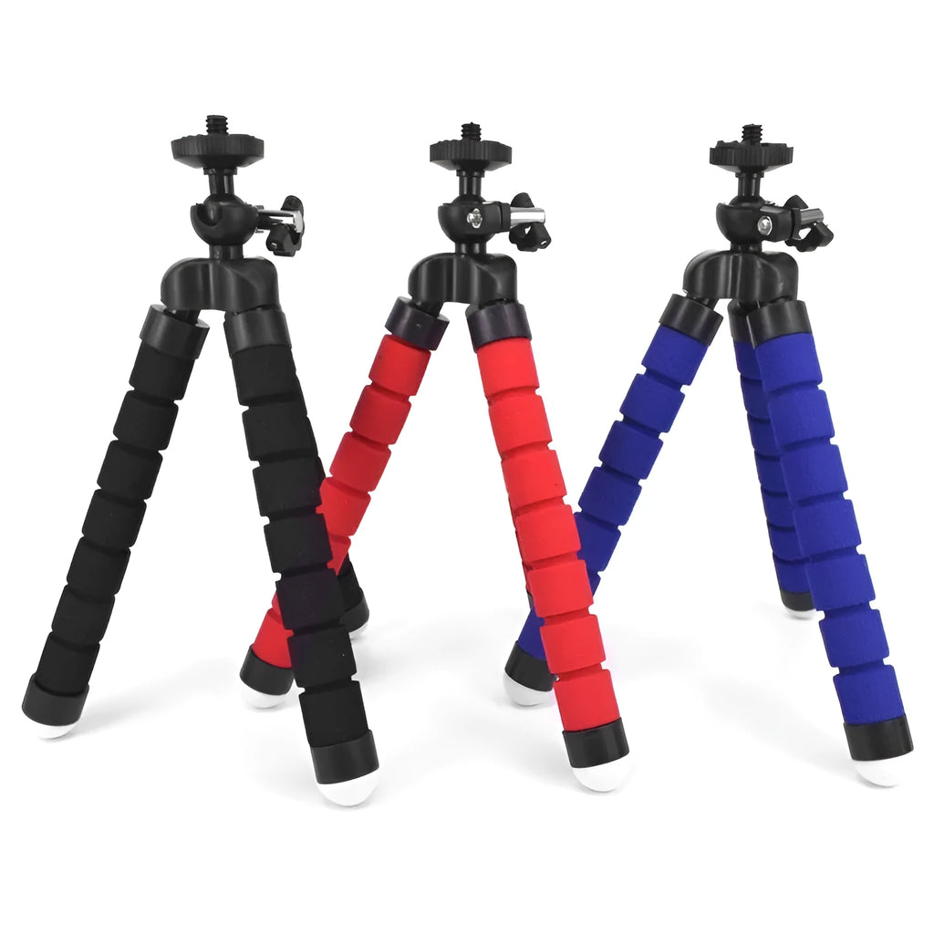 Black flexible octopus tripod with bent legs holding a smartphone on a table.
