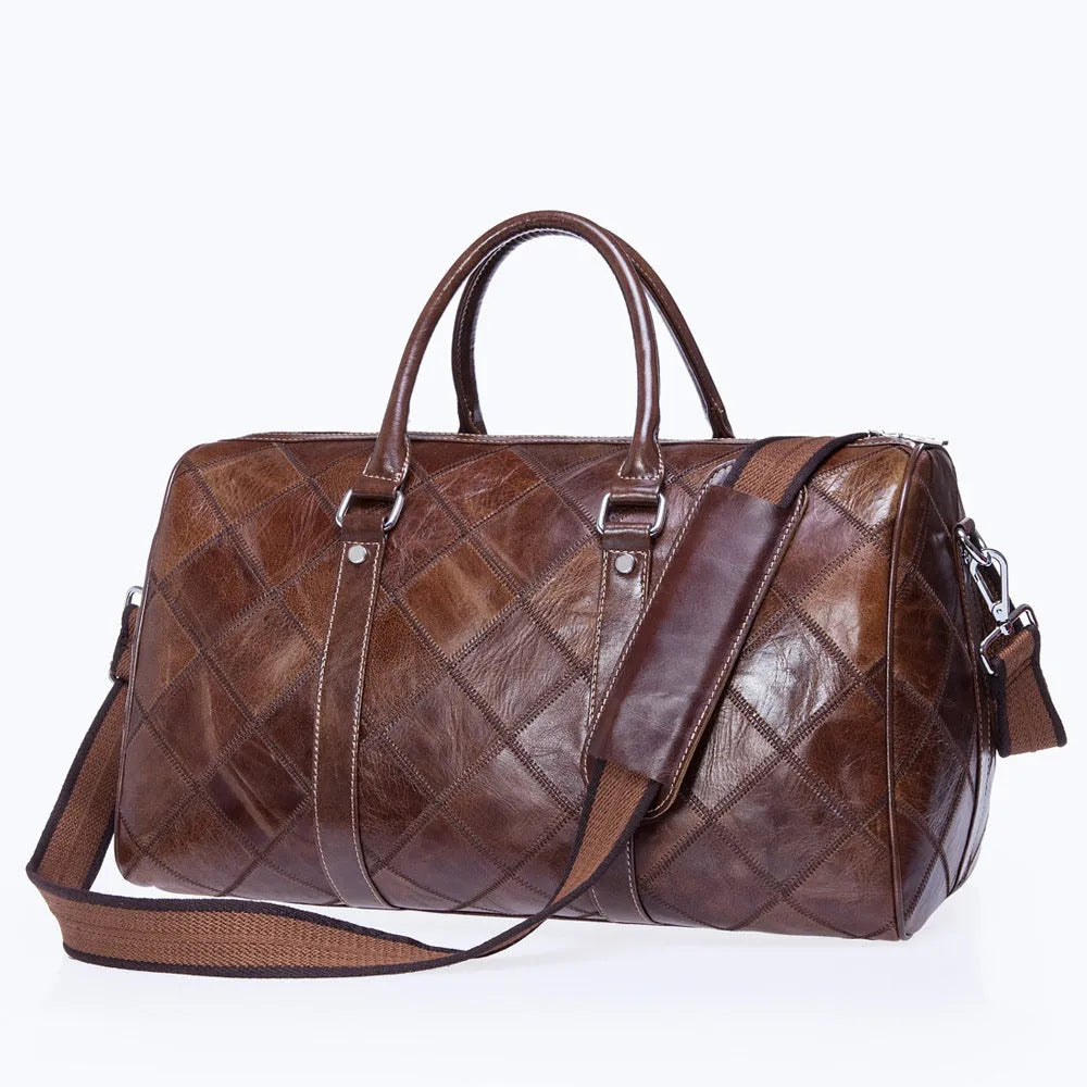 Vintage brown cowhide leather men's duffel bag with a single shoulder strap.