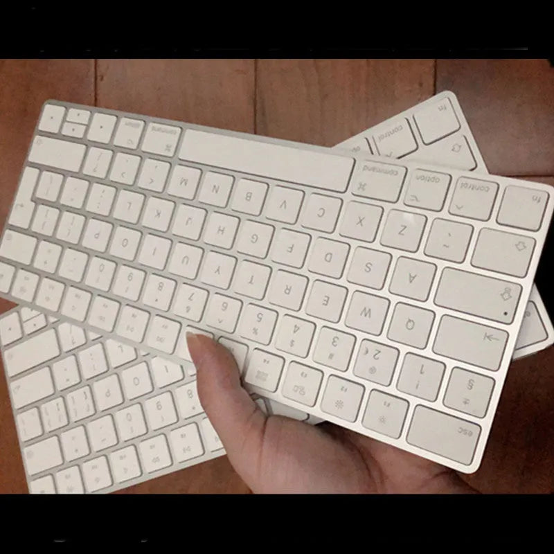 White Apple Bluetooth wireless keyboard with ultra-thin metal construction and multimedia function keys