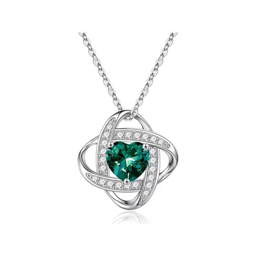 Copper heart necklace with electroplated platinum finish in five colour variations on model