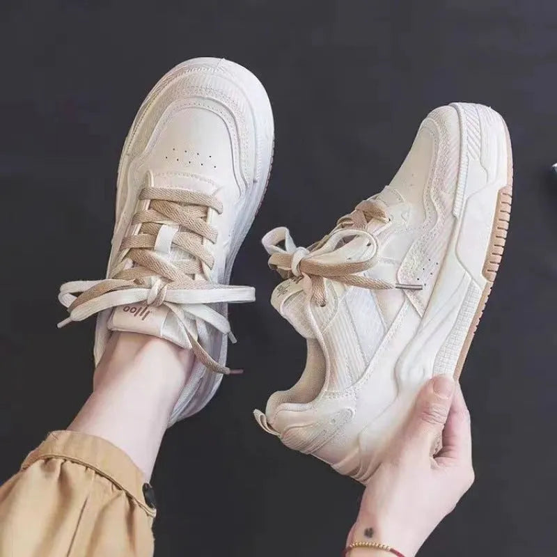 Low top rubber sneaker in pink or milky white with height increasing sole and breathable design