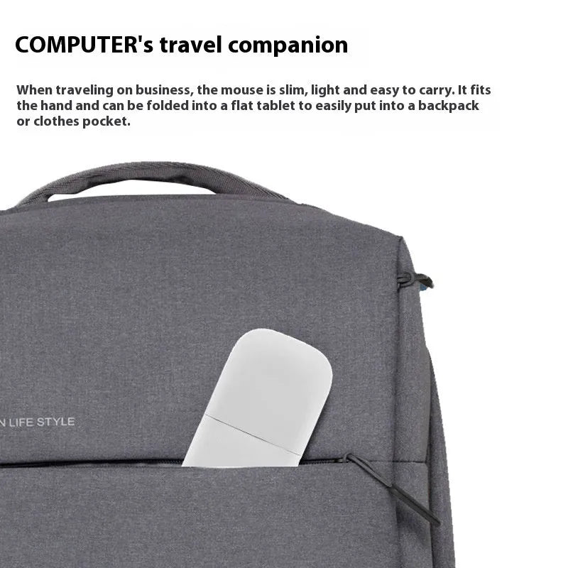 Black foldable Bluetooth touch wireless mouse shown open and closed next to a laptop