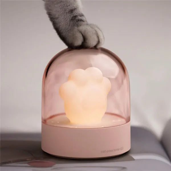 Grey cat paw shaped night light with USB charging cable and adjustable brightness controls