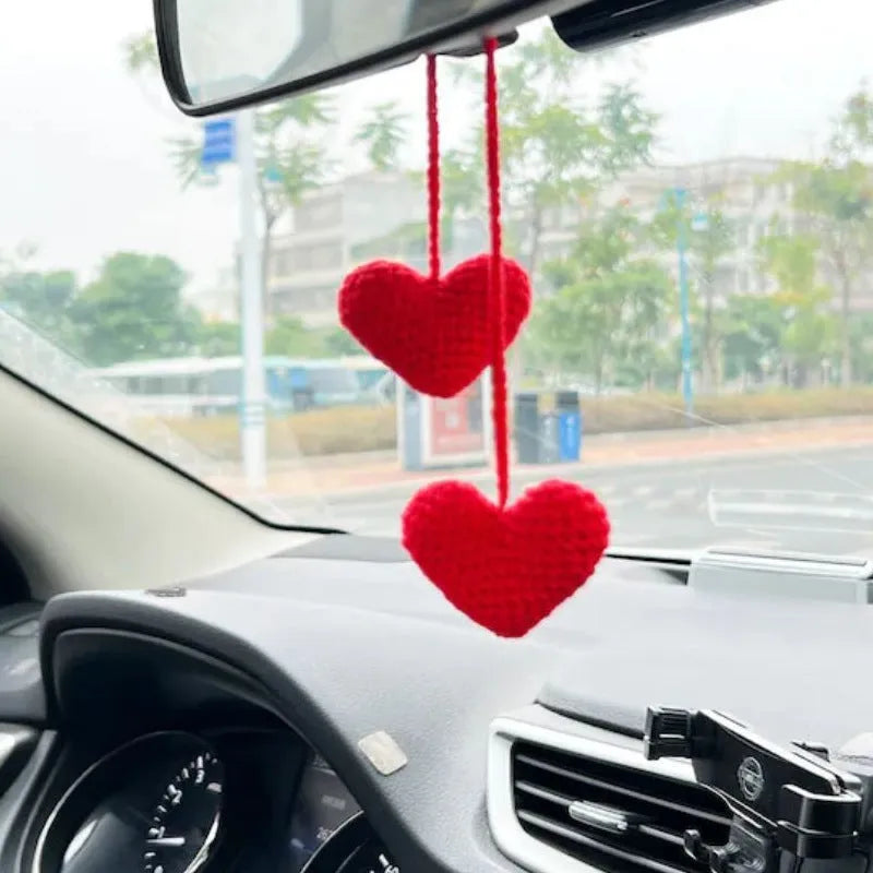 Green and white knitted wool car plant decoration with plastic base and hanging rope