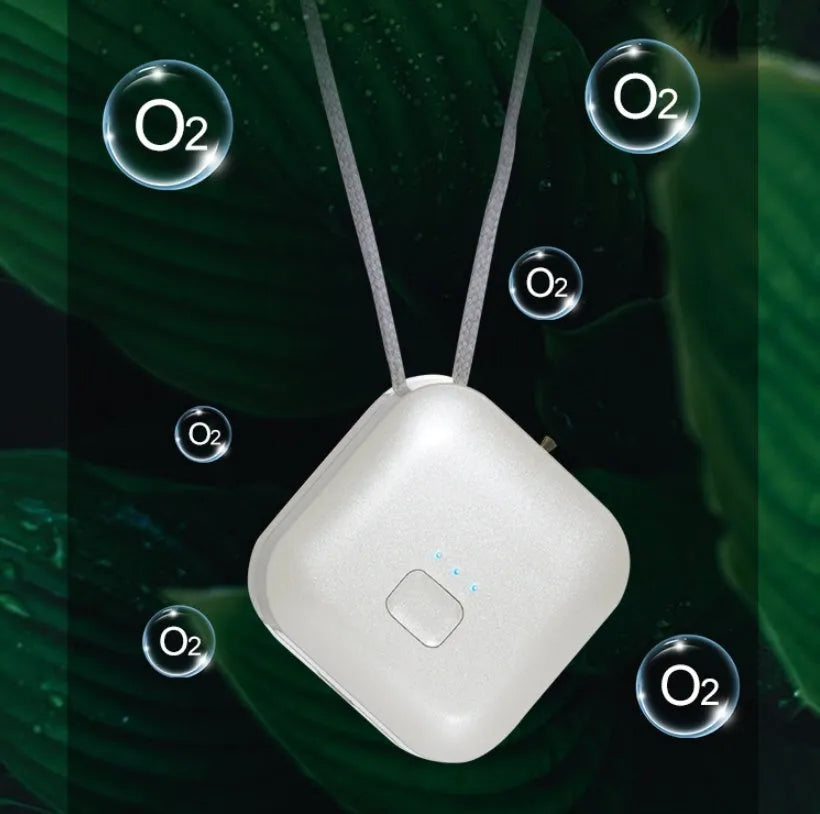 Mini USB air purifier necklace in pink, showing compact dimensions and wearable design.