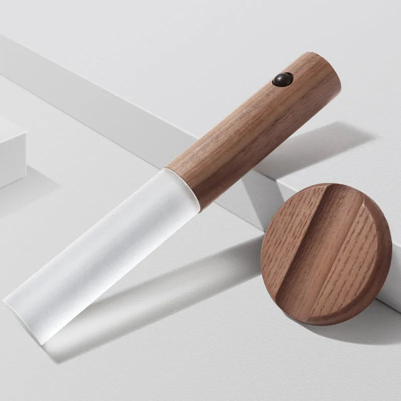 Smart sensor LED desk lamp in solid wood and acrylic on a desk, showing compact size and modern design.