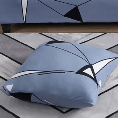 Printed geometric pattern sofa slipcover on a three-seater sofa in modern style