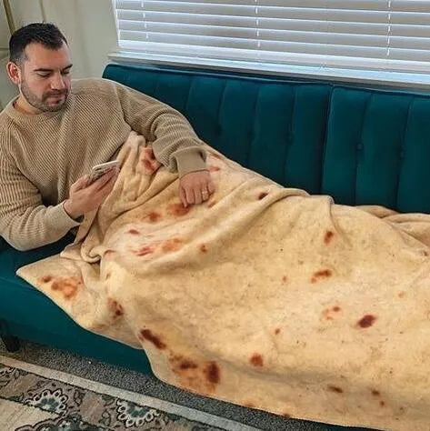 Round burrito blanket with coral fleece texture and food-themed print