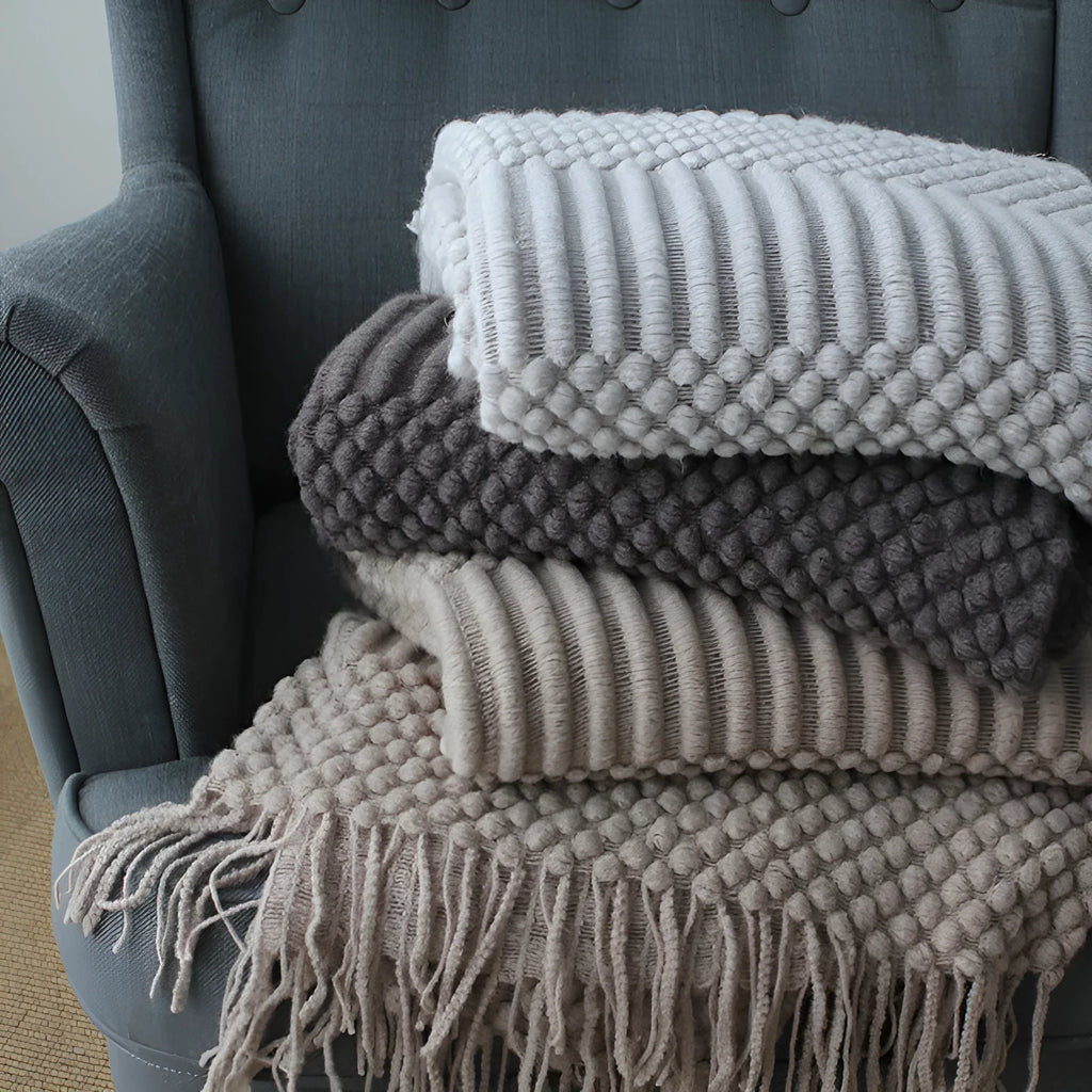 Small rectangular polyester nap blanket in dark grey, khaki, or light grey, shown flat with dimensions 127cm by 170cm.