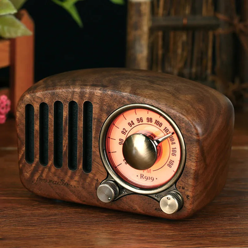 Retro wooden mini Bluetooth speaker in cherry wood finish showing front grille and wooden casing