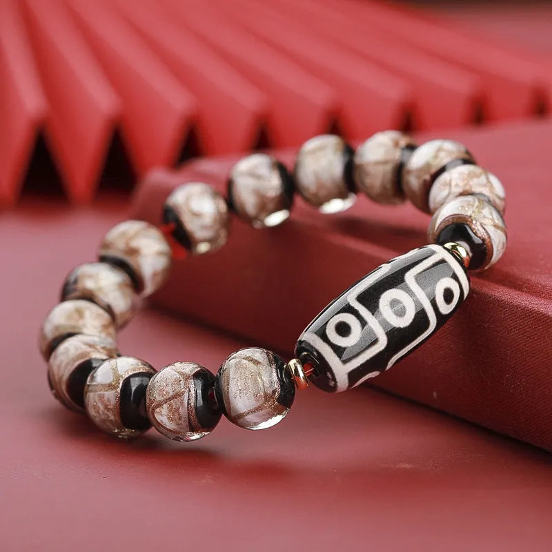 Chinese style lucky bracelet with colourful coloured glaze beads and auspicious patterns.