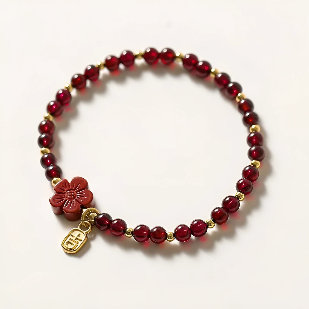 Women's freshwater pearl and geometric crystal bracelet on a black elastic braided rope.