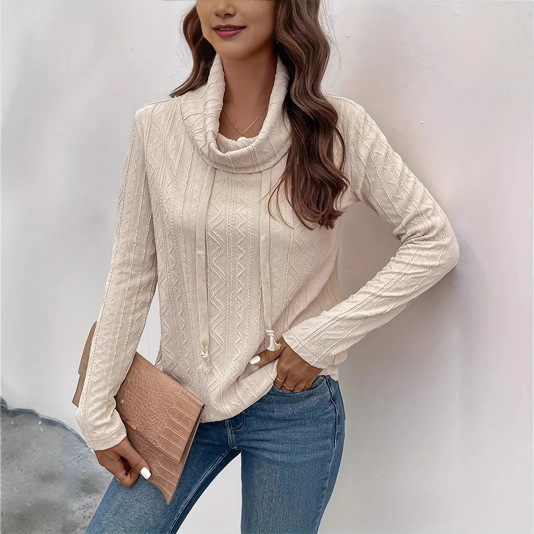 Apricot hooded pullover sweater with drawstring and long sleeves on a mannequin