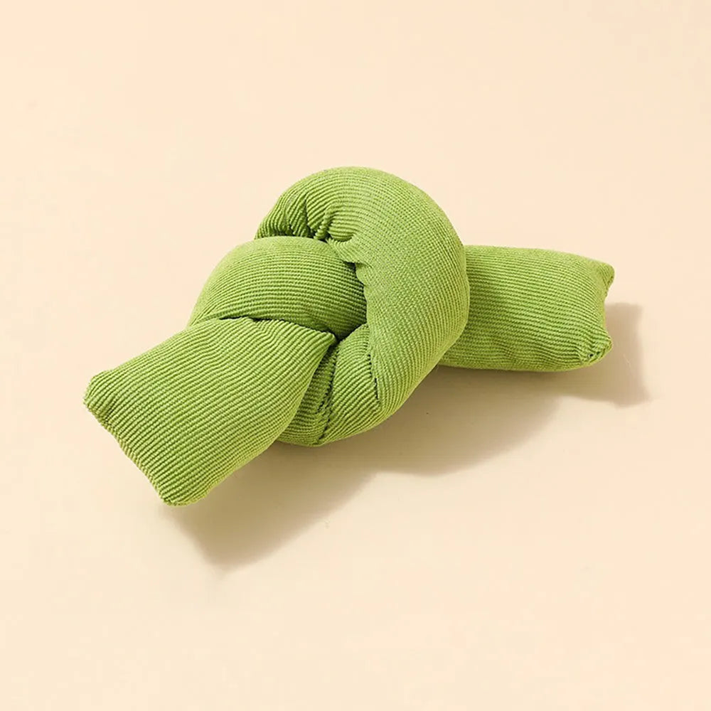 White knotted cotton dog rope toy for tugging and chewing.