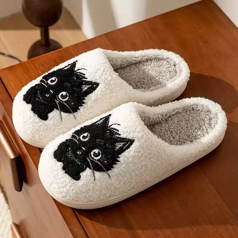 White plush slippers with Black Beard Cat cartoon couple pattern, velvet lining, and a textured non-slip sole.