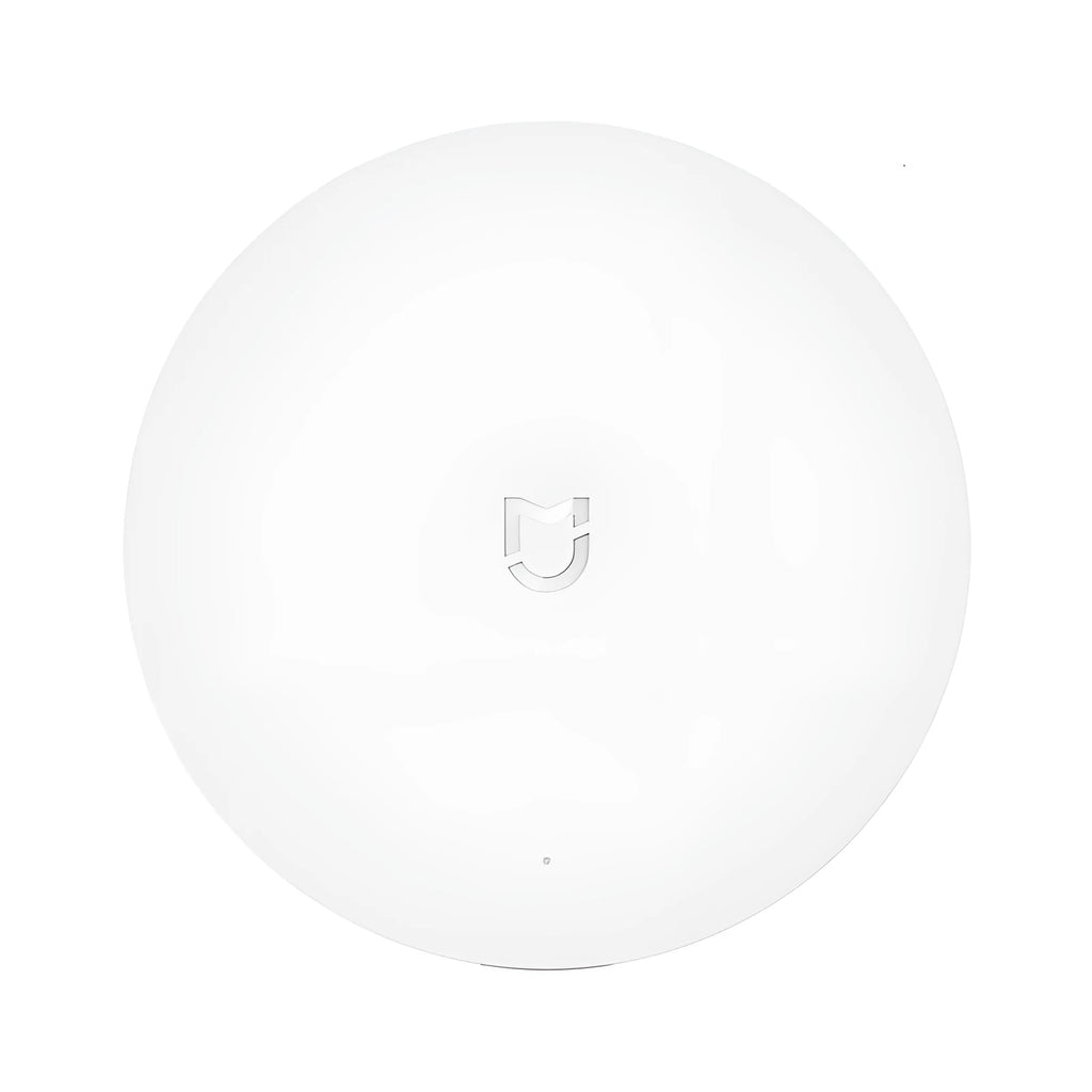 White Xiaomijia smart home gateway with UK plug, 90mm diameter, for wall mounting