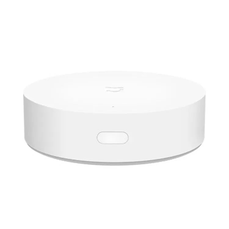 White Xiaomijia smart home gateway with UK plug, 90mm diameter, for wall mounting