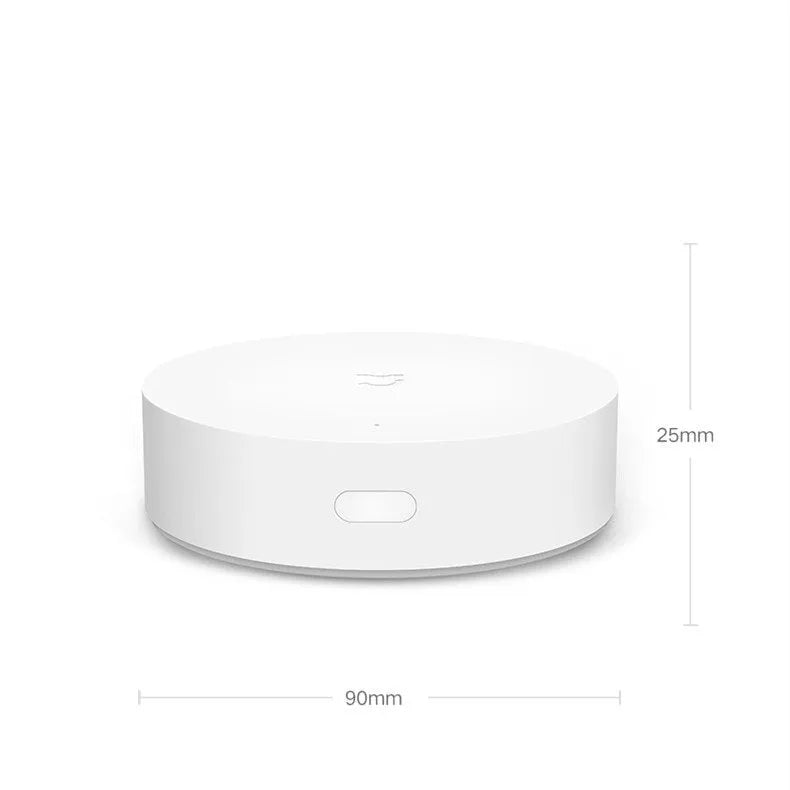 White Xiaomijia smart home gateway with UK plug, 90mm diameter, for wall mounting