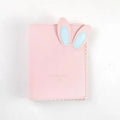 Cute bunny style mini photo album in blue, pink, or white, showing loose-leaf pages for 3-inch photos.