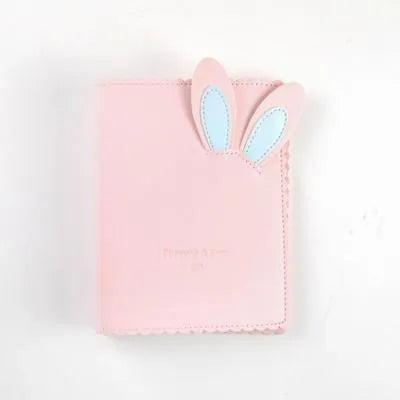 Cute bunny style mini photo album in blue, pink, or white, showing loose-leaf pages for 3-inch photos.