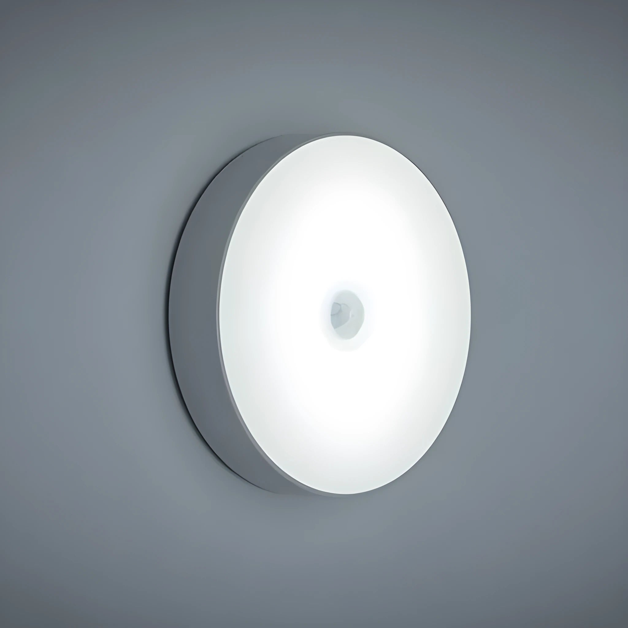 Small round beige or white LED night light with motion sensor and USB charging port