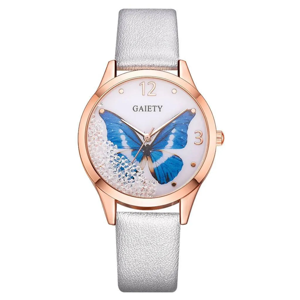 Gaiety brand ladies wristwatch with a removable rhinestone butterfly on a leather strap, showing a round sky blue dial.