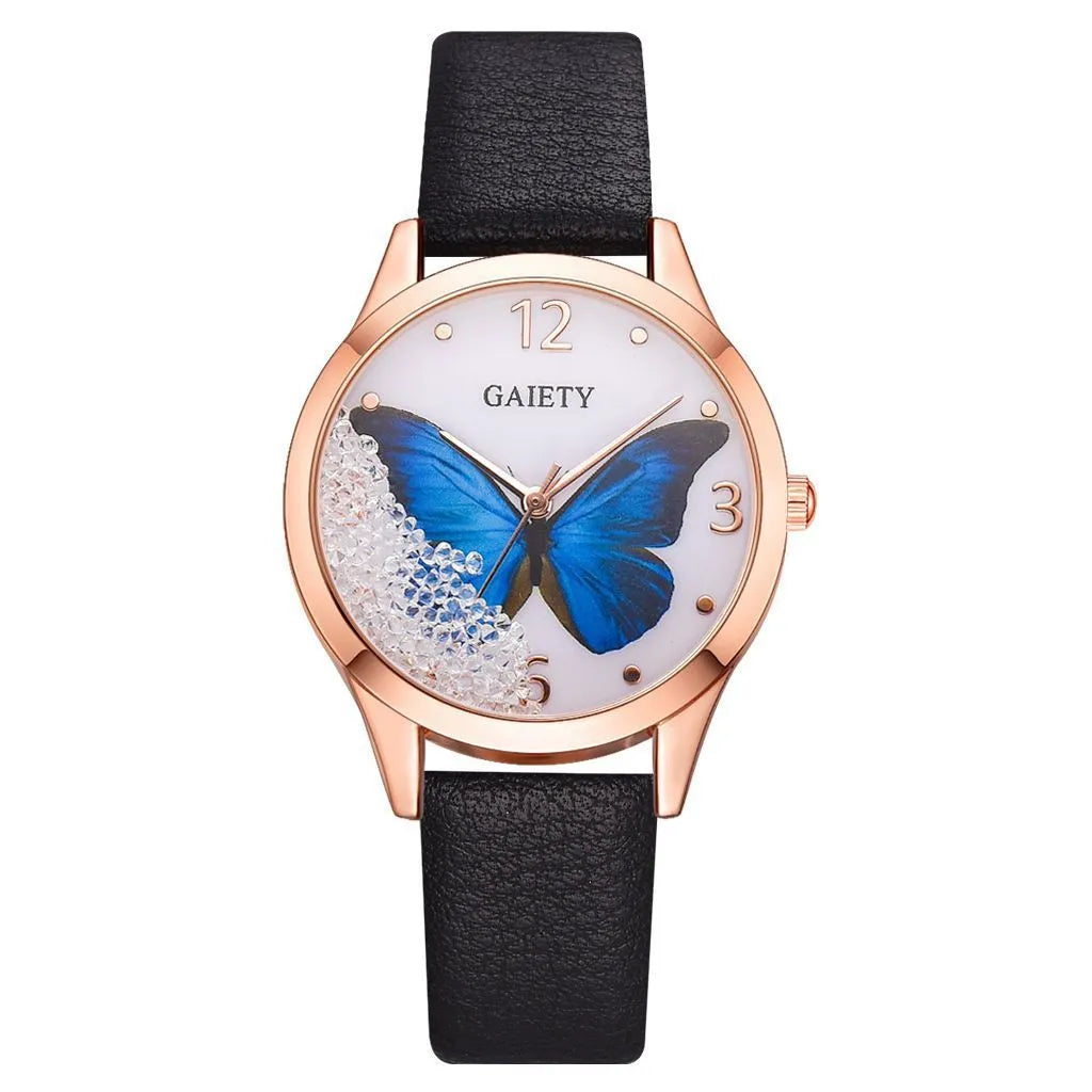 Gaiety brand ladies wristwatch with a removable rhinestone butterfly on a leather strap, showing a round sky blue dial.