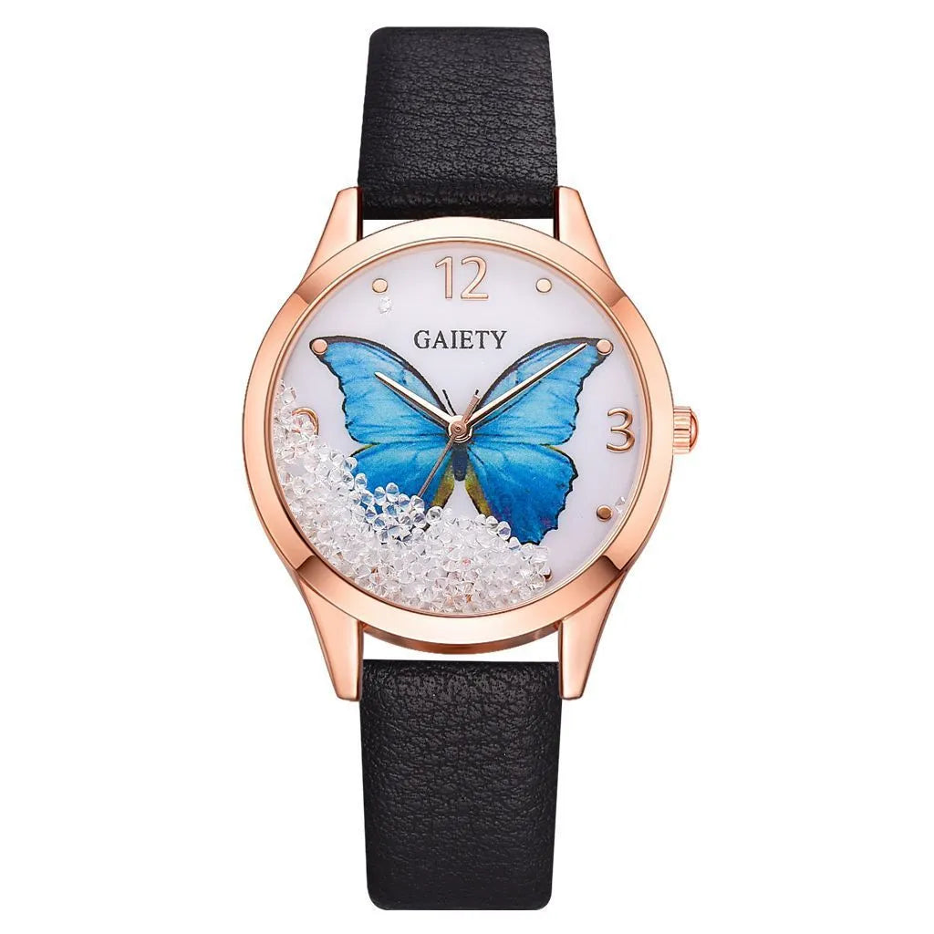 Gaiety brand ladies wristwatch with a removable rhinestone butterfly on a leather strap, showing a round sky blue dial.