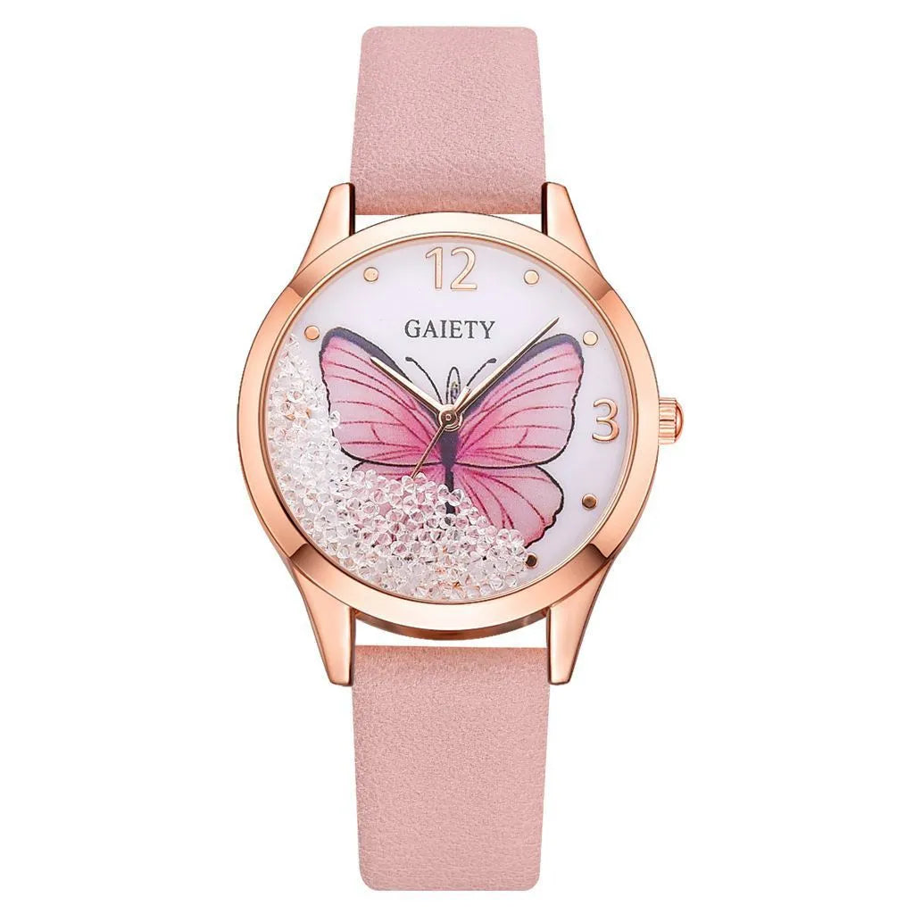 Gaiety brand ladies wristwatch with a removable rhinestone butterfly on a leather strap, showing a round sky blue dial.