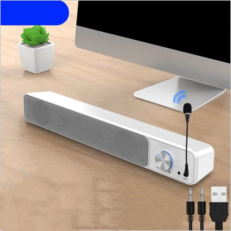 Black and white G18 wired desktop computer speaker with ABS PC shell on a desk.