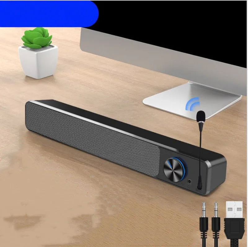 Black and white G18 wired desktop computer speaker with ABS PC shell on a desk.