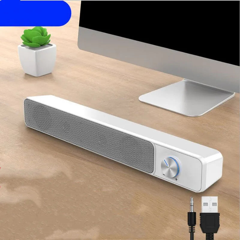 Black and white G18 wired desktop computer speaker with ABS PC shell on a desk.