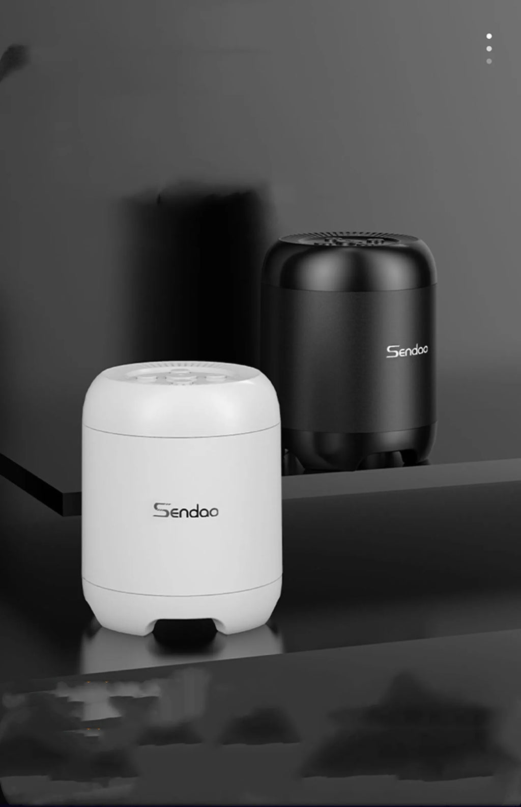 Compact black or white wireless Bluetooth speaker with subwoofer, card reader, and USB port