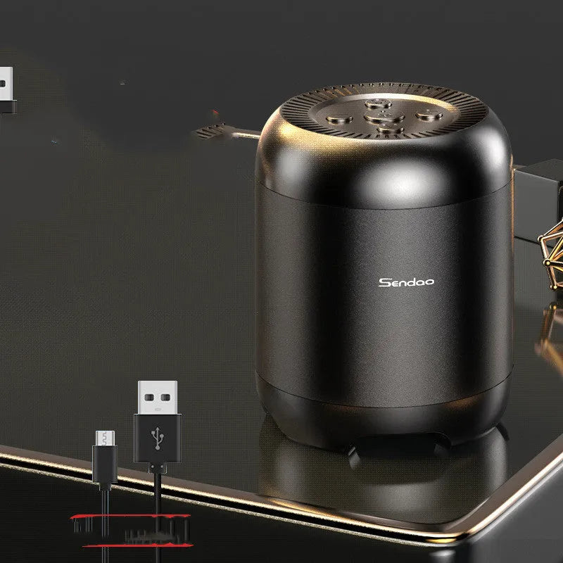 Compact black or white wireless Bluetooth speaker with subwoofer, card reader, and USB port