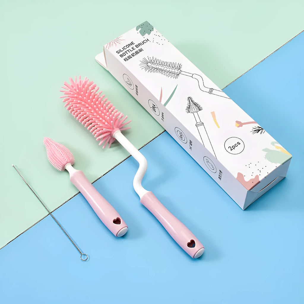 Silicone baby bottle brush with straw cleaning attachment in pink, blue, and yellow colours
