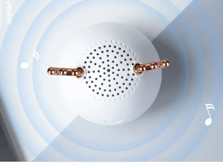 Small white Bluetooth speaker measuring 75mm with USB charging cable