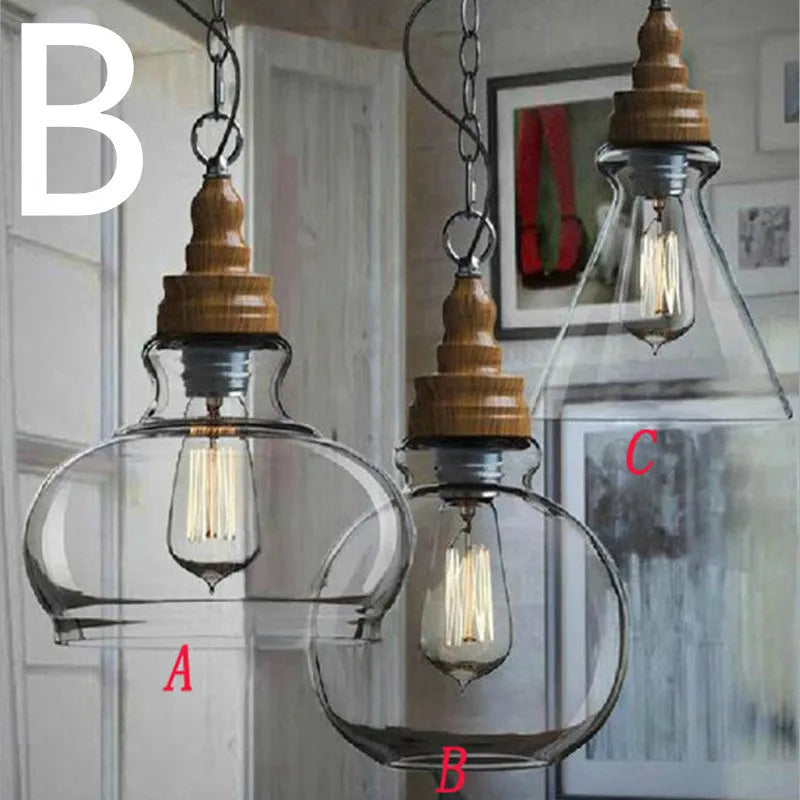 Nordic style single head pendant light with wood grain glass shade on an adjustable cable.