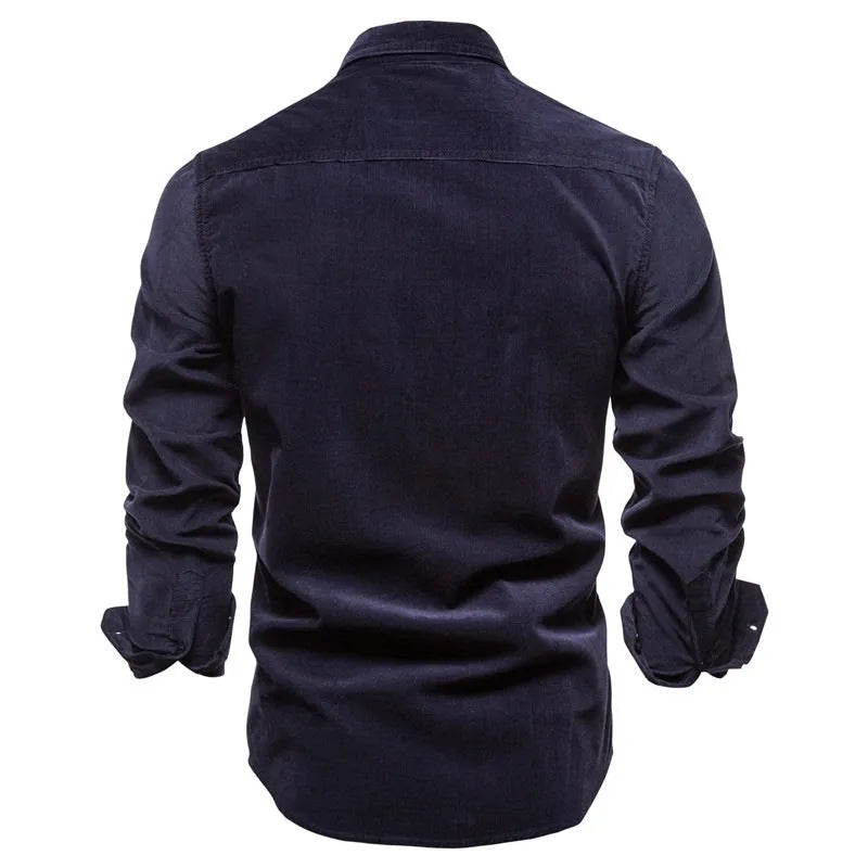 Men's long sleeve linen shirt in Denim Blue on a hanger, showing button front and cuff detail.